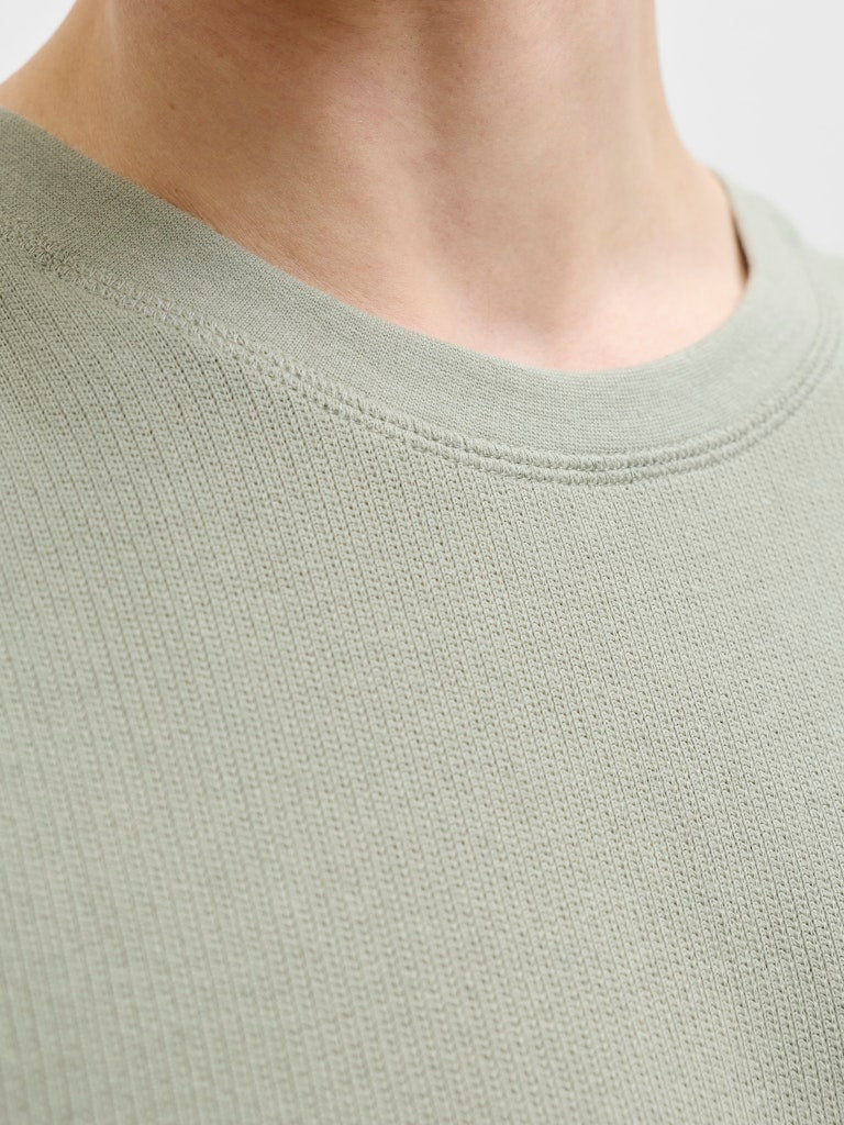 6010856